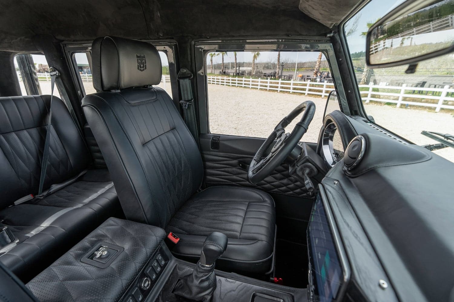 Interior Shot: Luxury Cabin Bespoke Land Rover Defender interior featuring black leather seating and premium finishes
