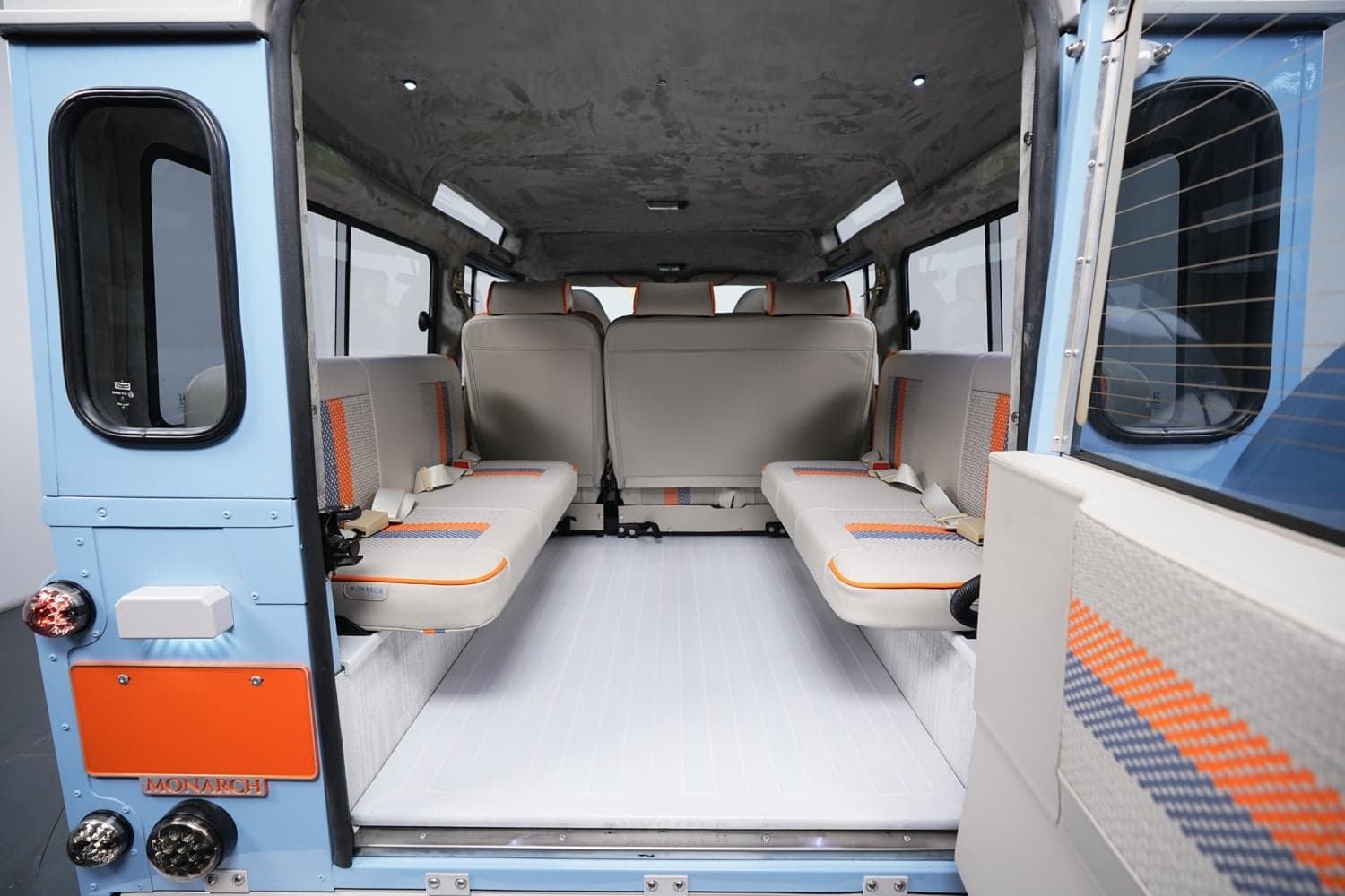 Interior Shot: Custom Seating Design Interior view of a bespoke Land Rover Defender showcasing premium seating and modern design