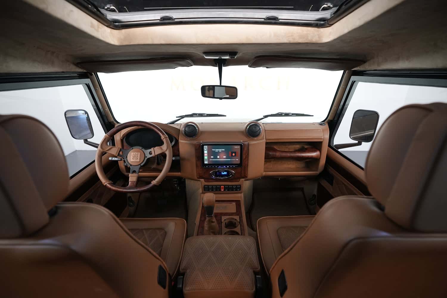 Interior Shot: Luxury Cabin Design Bespoke Land Rover Defender interior featuring premium leather and modern technology