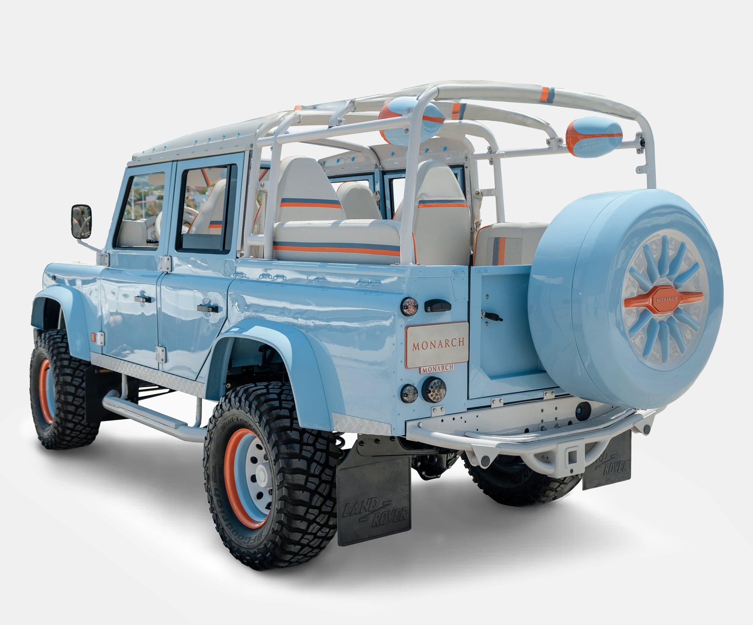 Rear View: Custom Land Rover Defender Bespoke Land Rover Defender in light blue with white and orange accents