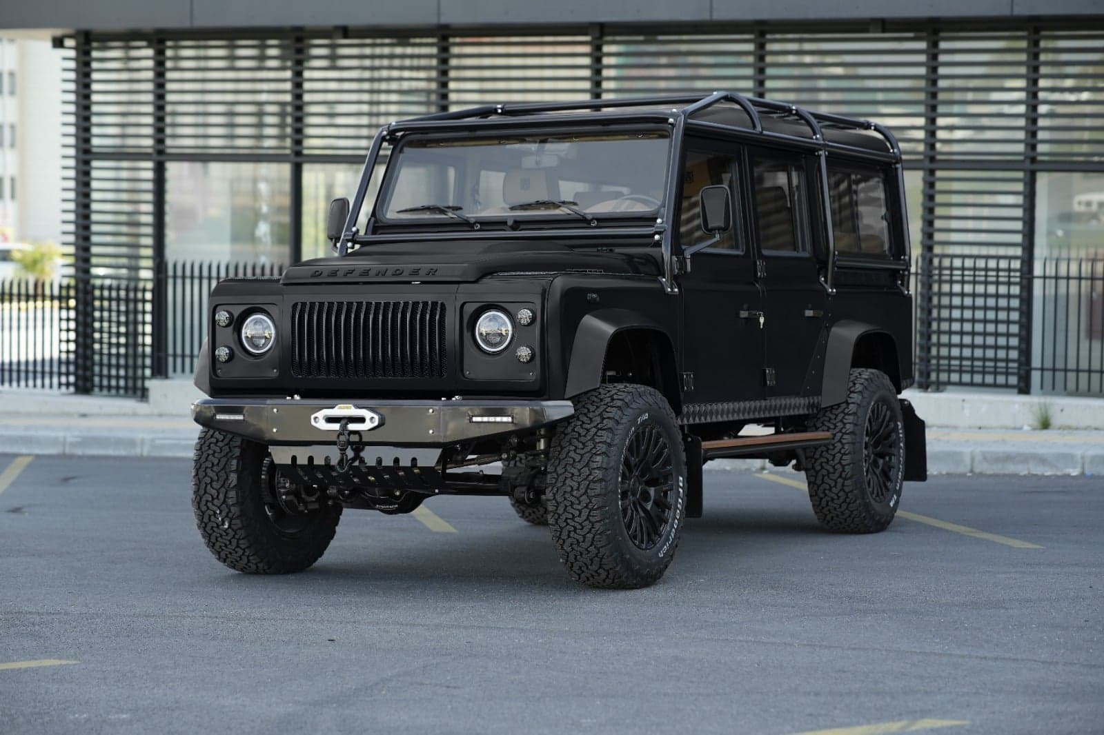 A restored classic Defender 90 within the US parked on an American landscape, showcasing the finished result of a successful import